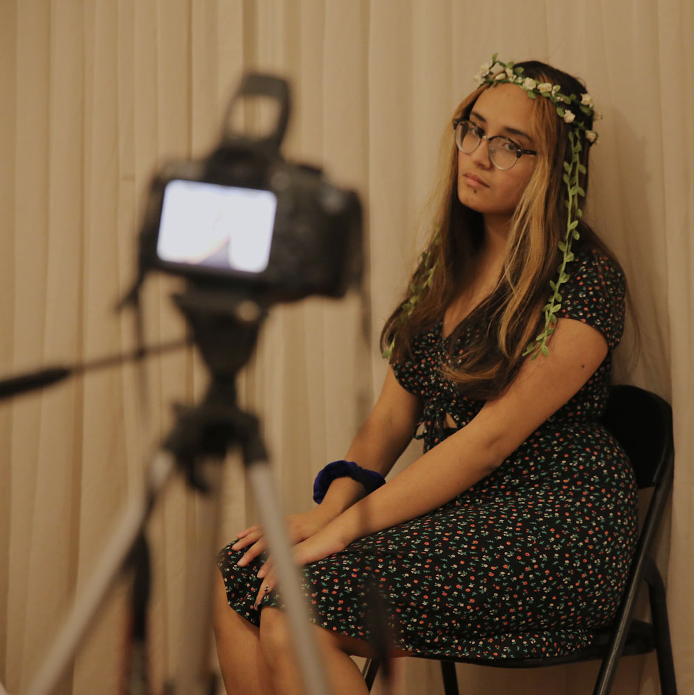 Photographer Alice Moreno posing for her camera.