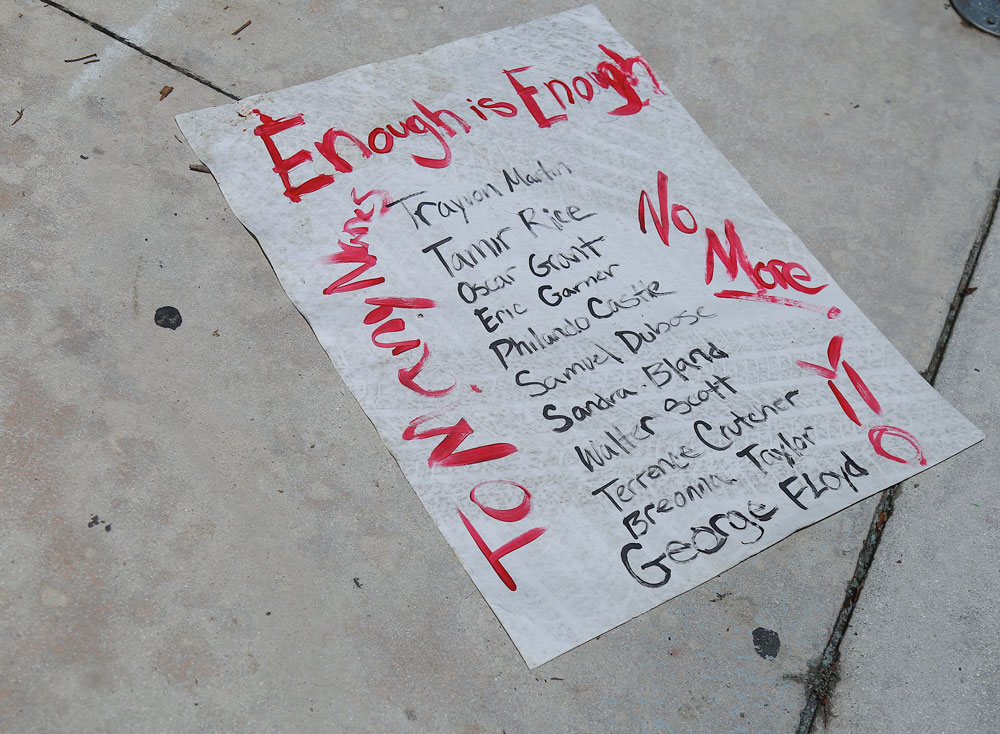 A poster with the names of young black men who have been killed by police officers.