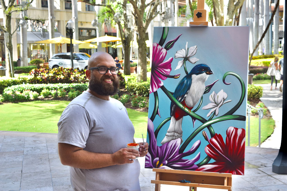 Artist with his artwork.