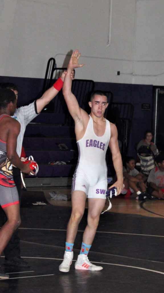 Noel Fuentes winning a wrestling match.