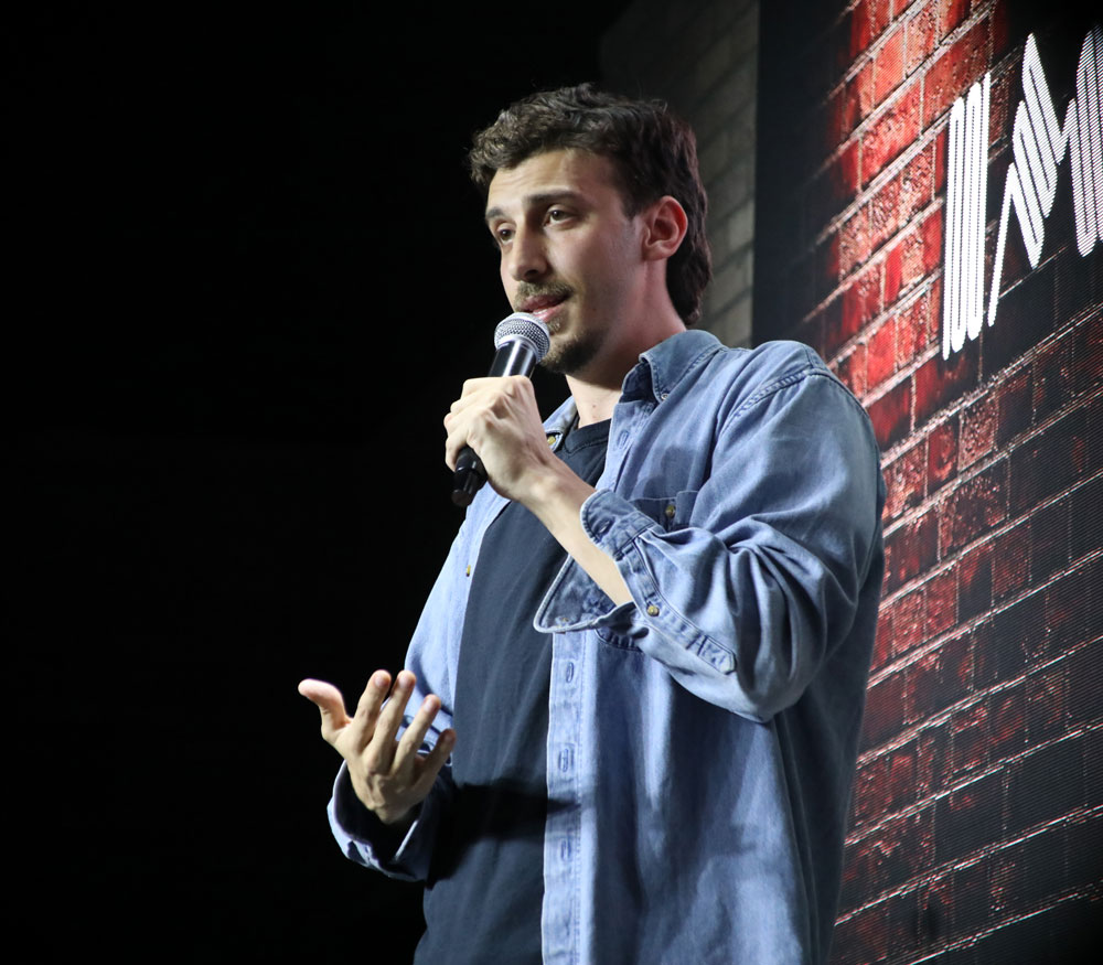 Comedian on stage.